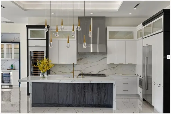 a bathroom with a granite countertop sink a mirror and a shower