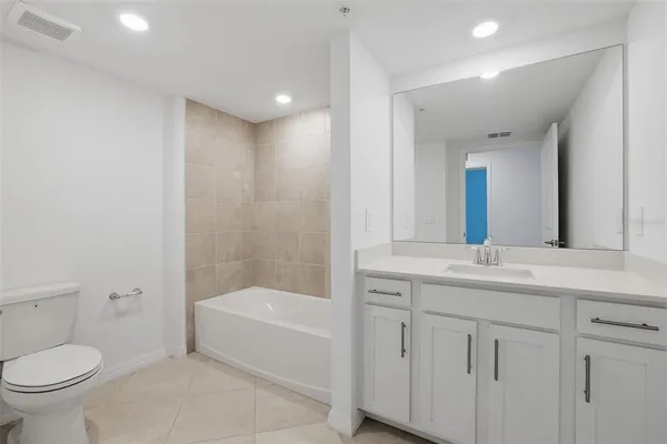 a bathroom with a toilet sink and bathtub