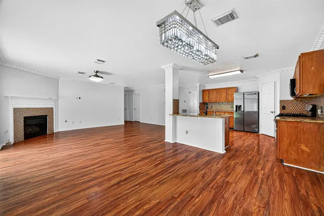a view of a kitchen with microwave and cabinets