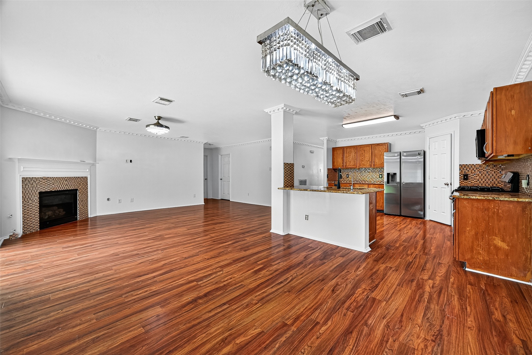 634 Hawthorne Pasture Road Rosenberg, TX 77471 - Photo 15 of 49 a view of a kitchen with microwave and cabinets