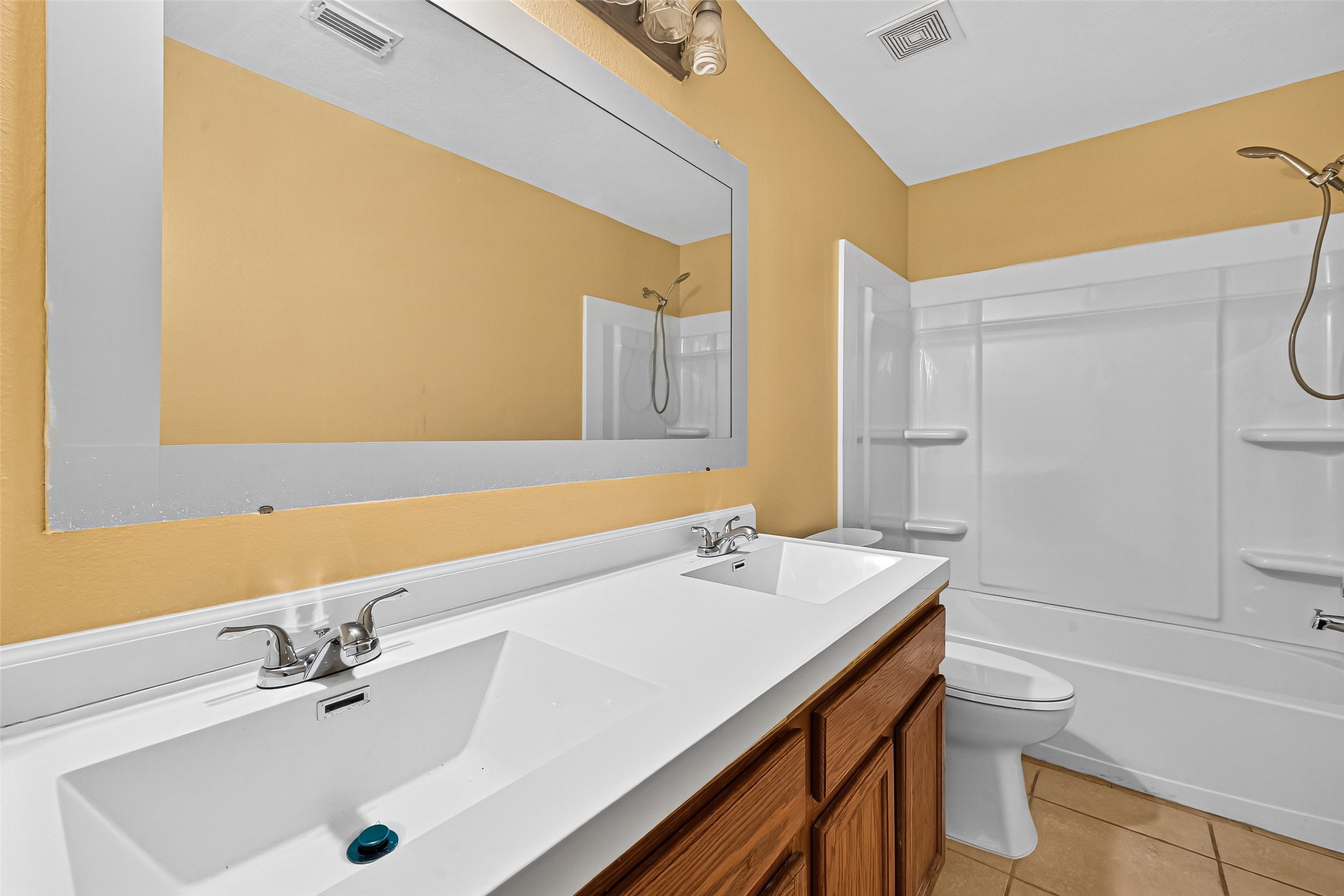 634 Hawthorne Pasture Road Rosenberg, TX 77471 - Photo 28 of 49 a bathroom with a sink a toilet and shower