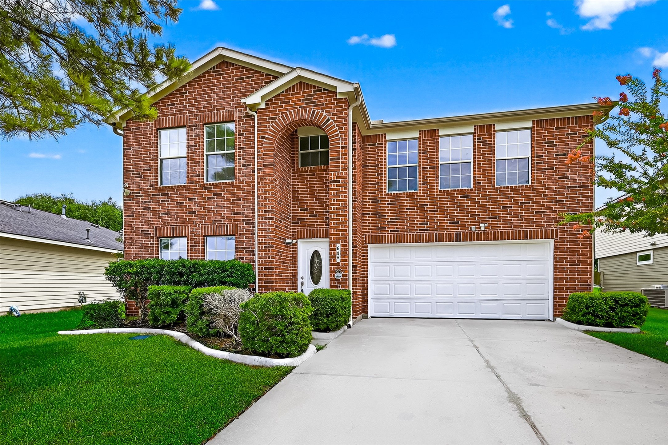 634 Hawthorne Pasture Road Rosenberg, TX 77471 - Photo 3 of 49 a front view of a house with a yard and garage