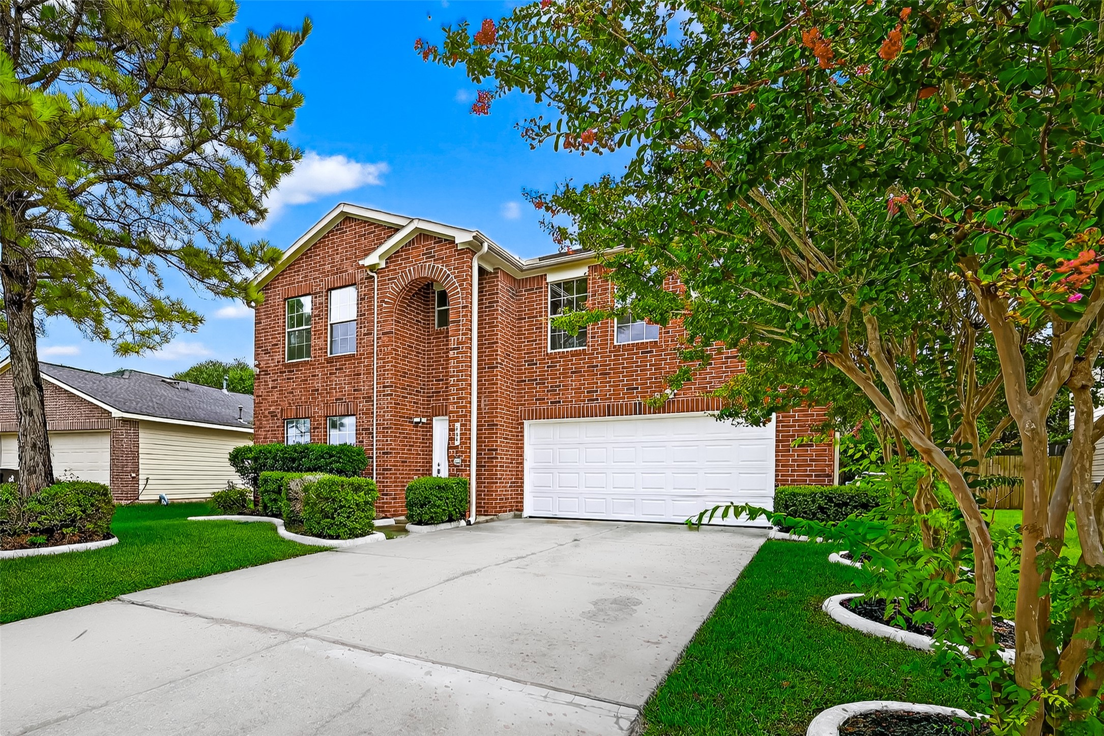 634 Hawthorne Pasture Road Rosenberg, TX 77471 - Photo 4 of 49 a front view of a house with a yard and garage
