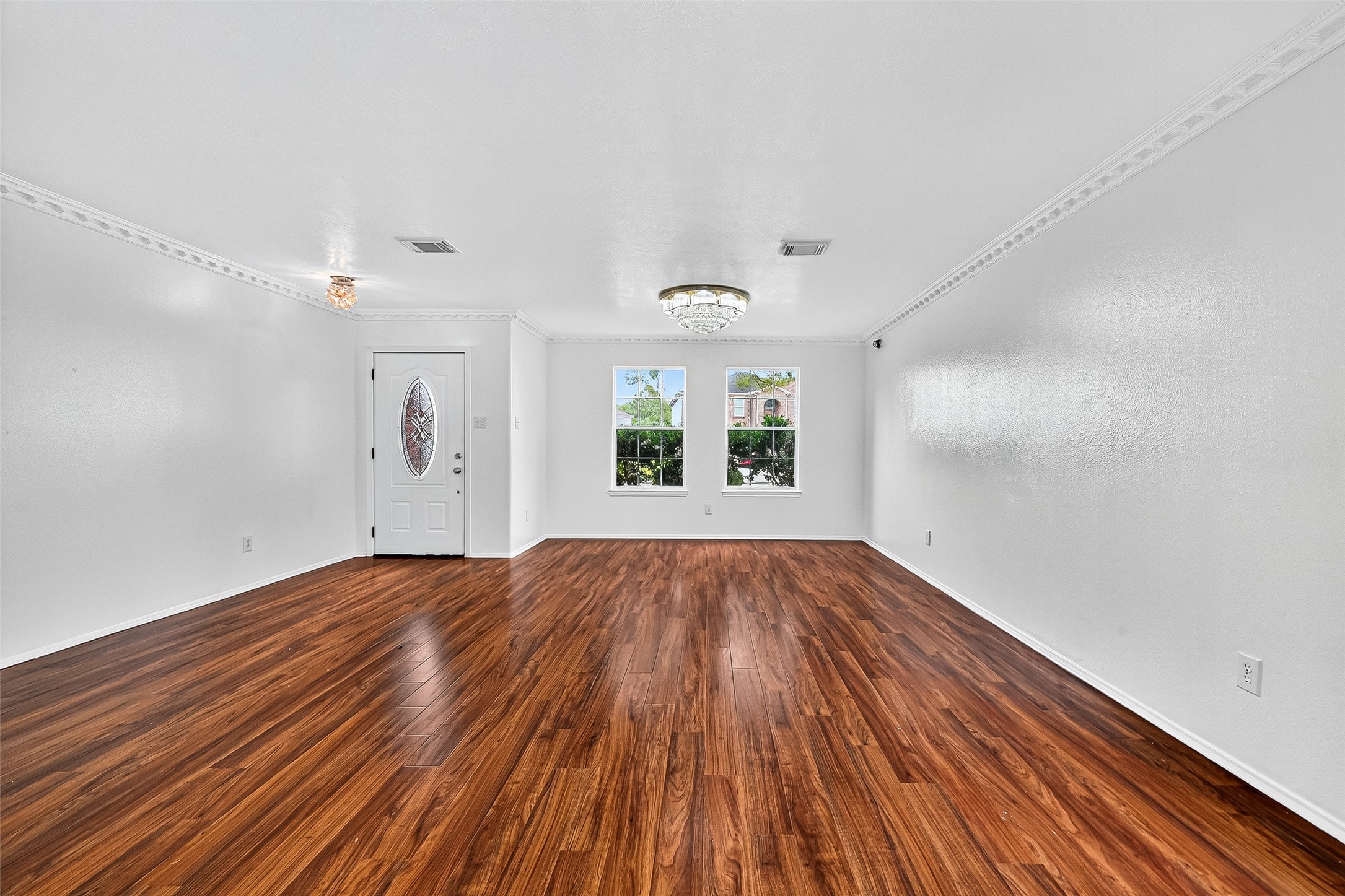 634 Hawthorne Pasture Road Rosenberg, TX 77471 - Photo 8 of 49 wooden floor in an empty room with a window