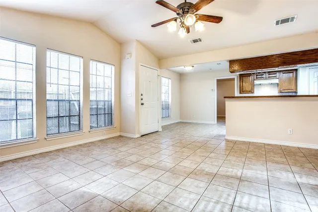 a view of an empty room with a window