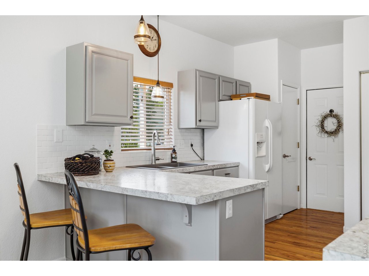5116 West 6th Street Road Greeley, CO 80634 - Photo 18 of 44 Kitchen Pantry, Access to Garage & Laundry