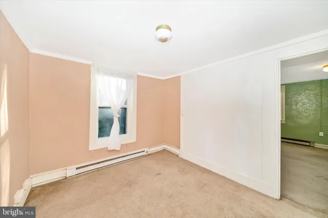 a bathroom with a shower curtain and a toilet