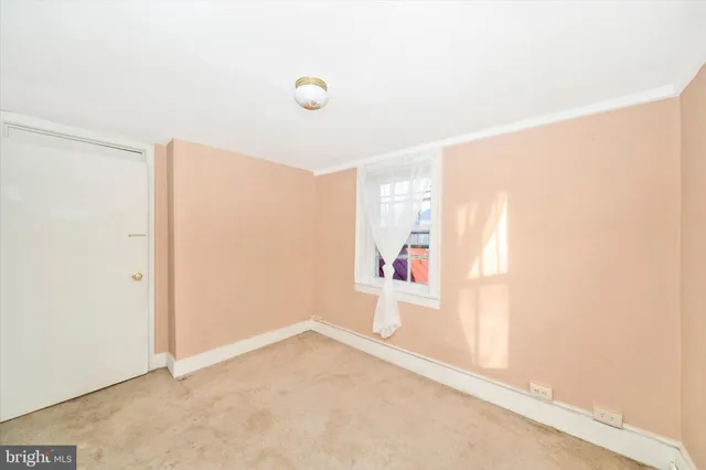 a view of a house with a small yard and plants