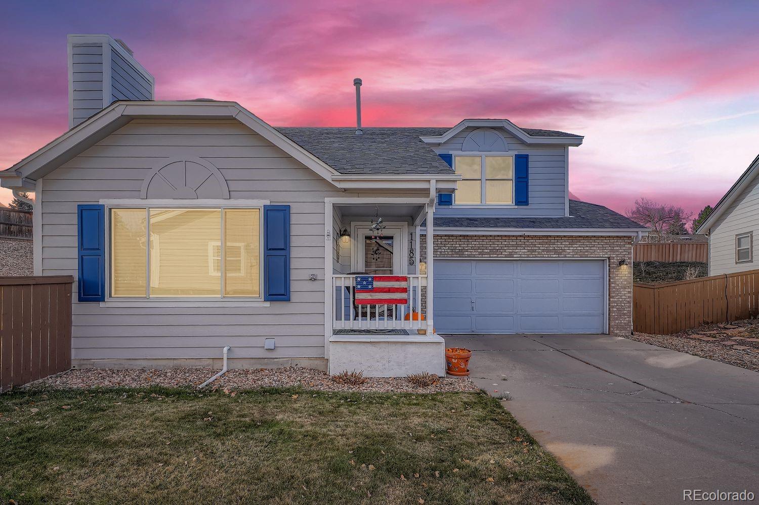 a front view of a house with garage