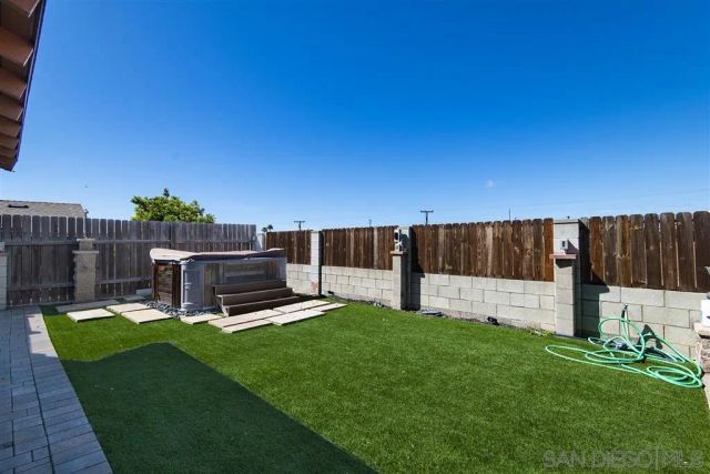 a view of a backyard with sitting area