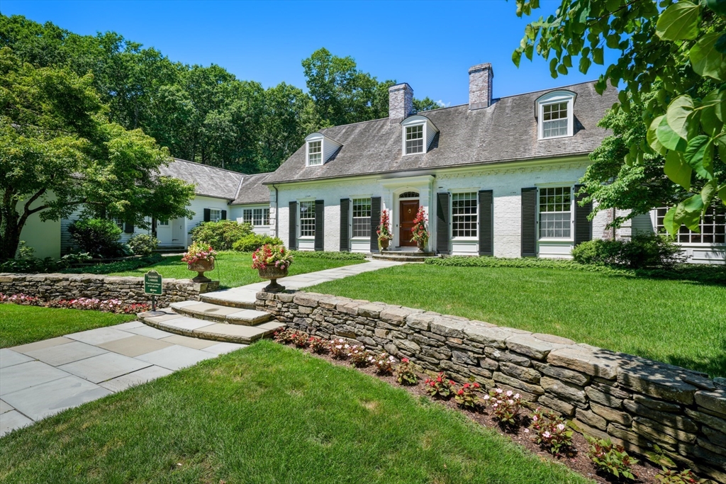 100 Chestnut Street Weston, MA 02493 - Photo 2 of 17 a front view of a house with a yard and potted plants