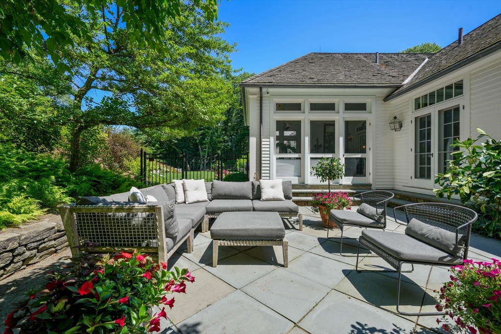 100 Chestnut Street Weston, MA 02493 - Photo 9 of 17 a view of a patio filled with furniture