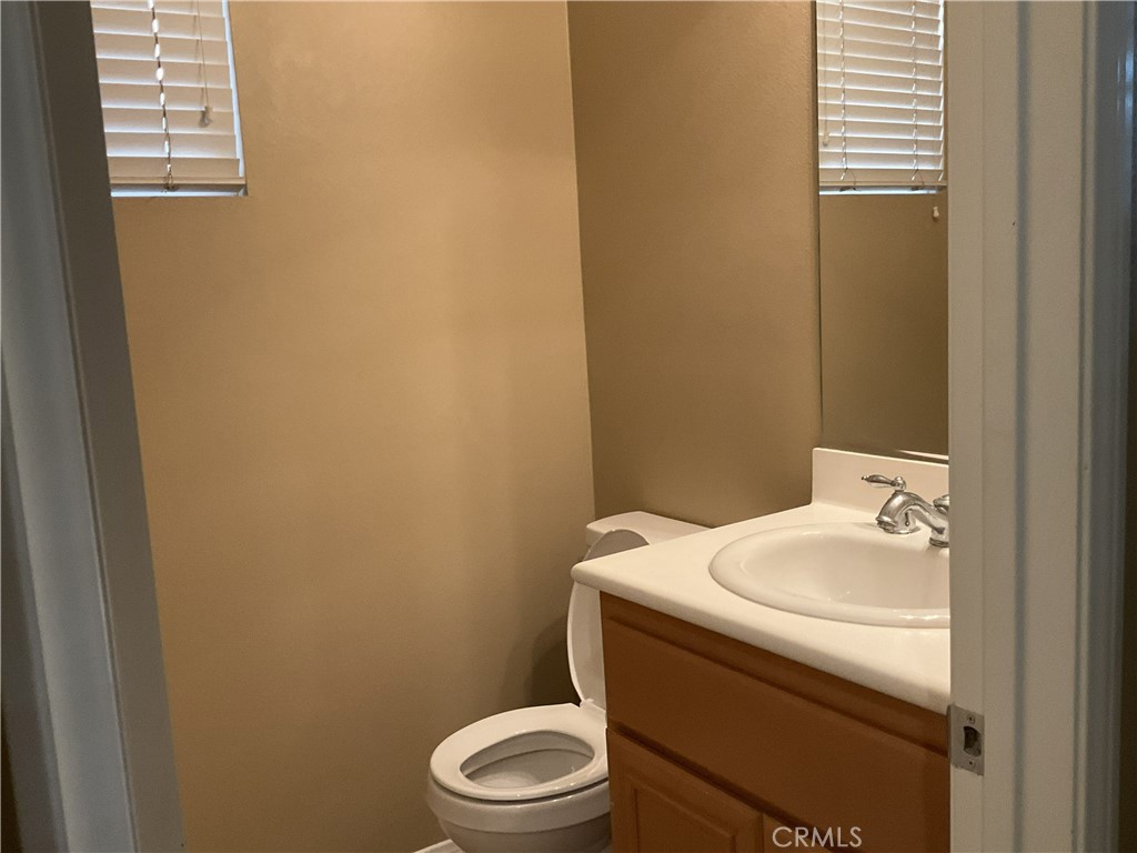 4574 Sandano Street Riverside, CA 92507 - Photo 7 of 12 a bathroom with a sink toilet and window