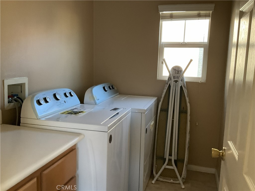 4574 Sandano Street Riverside, CA 92507 - Photo 9 of 12 a utility room with a window