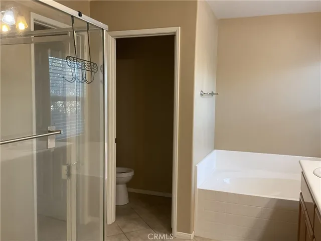 a bathroom with a shower and a toilet