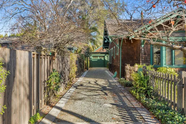 a view of a pathway with a garden