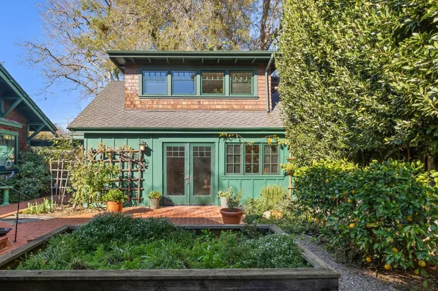 a front view of a house with garden