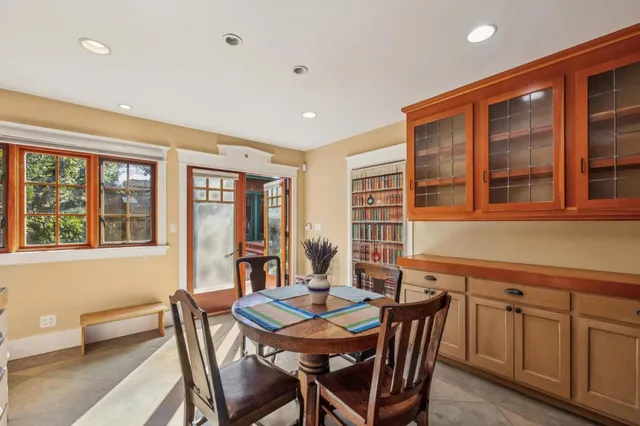 a view of a dining room with furniture and windows
