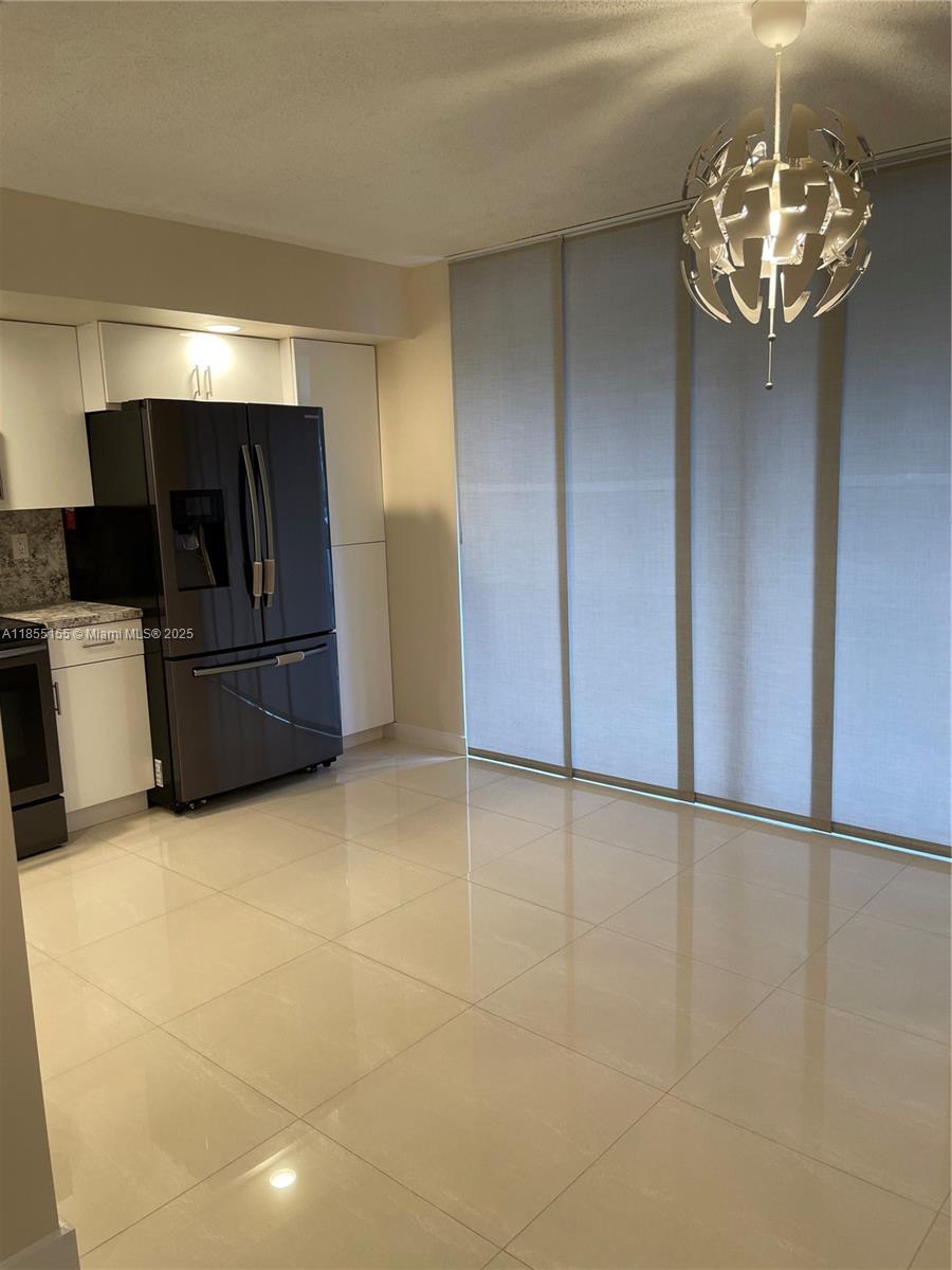 Horizons West Miami, FL 33183 - Photo 3 of 9 a view of an empty room with a kitchen