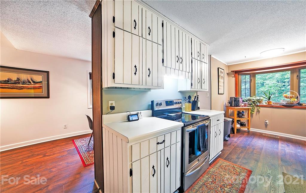 2 Arnstein Circle Fletcher, NC 28732 - Photo 11 of 29 a open kitchen with stainless steel appliances granite countertop a stove a sink and a refrigerator
