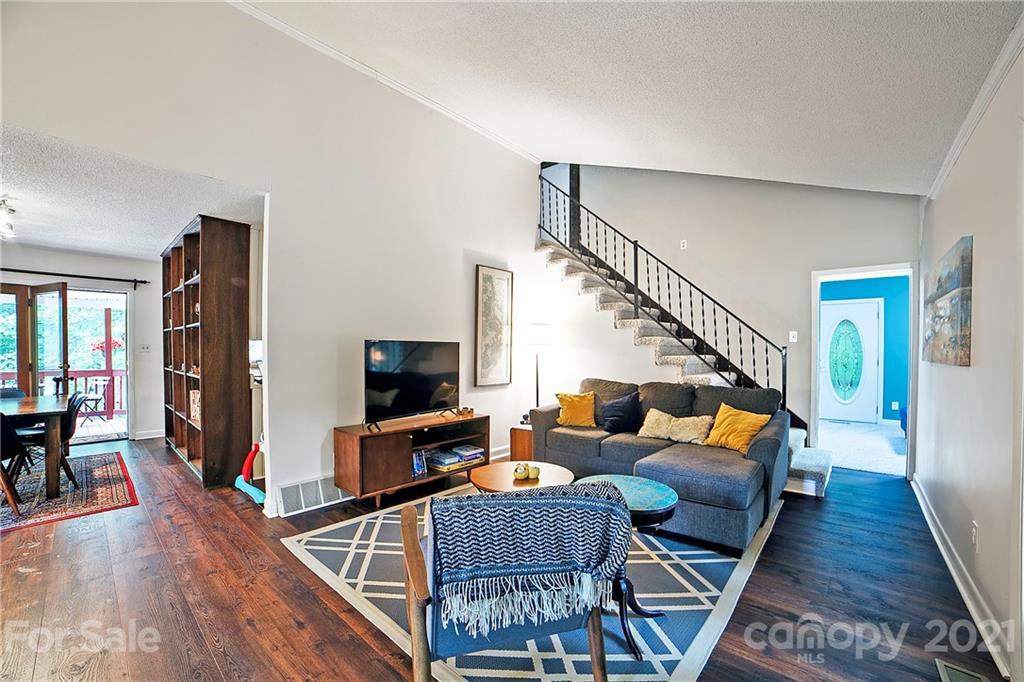 2 Arnstein Circle Fletcher, NC 28732 - Photo 23 of 29 a living room with furniture and a flat screen tv