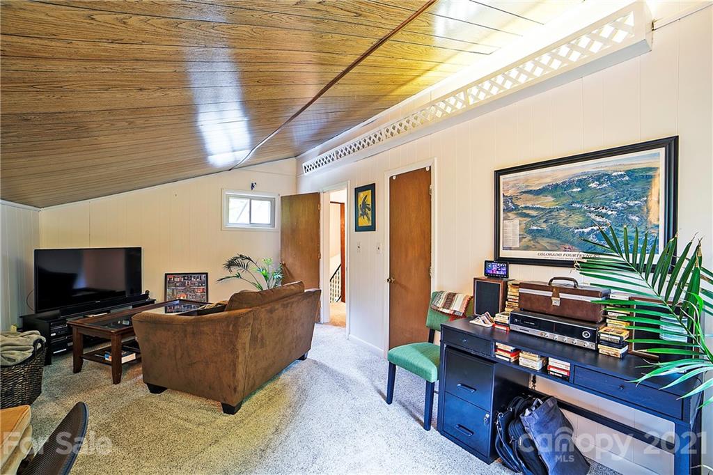2 Arnstein Circle Fletcher, NC 28732 - Photo 25 of 29 a living room with furniture and a flat screen tv