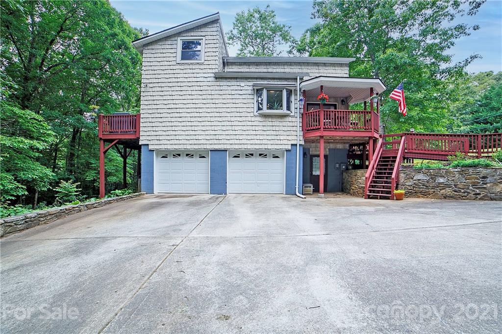 2 Arnstein Circle Fletcher, NC 28732 - Photo 27 of 29 a front view of a house with a yard and garage
