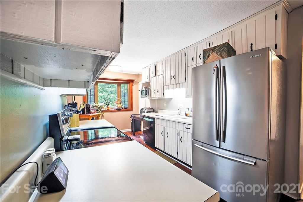 2 Arnstein Circle Fletcher, NC 28732 - Photo 10 of 29 a kitchen with stainless steel appliances a refrigerator and a stove top oven