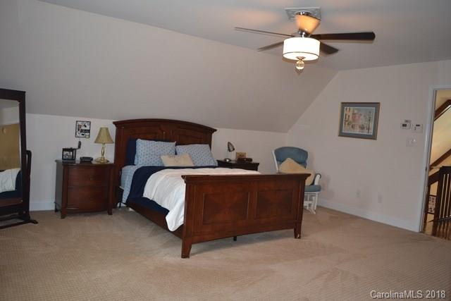 309 Parker Road York, SC 29745 - Photo 10 of 25 a bed room with a bed and a chandelier