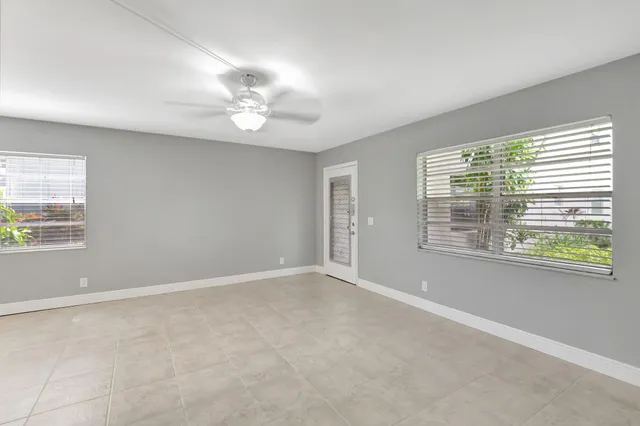 a view of an empty room with a window