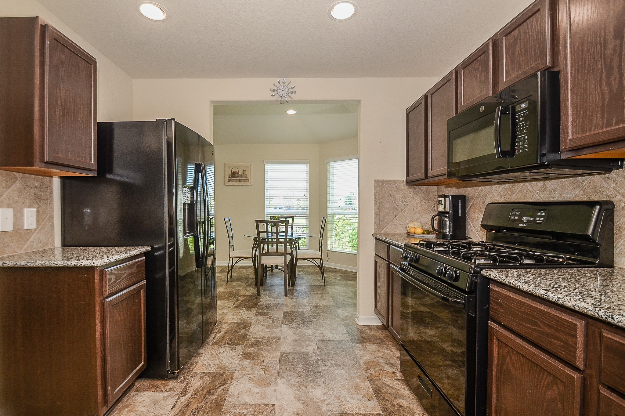 3027 Narrow Stream Way Katy, TX 77493 - Photo 10 of 32 Kitchen with granite countertops