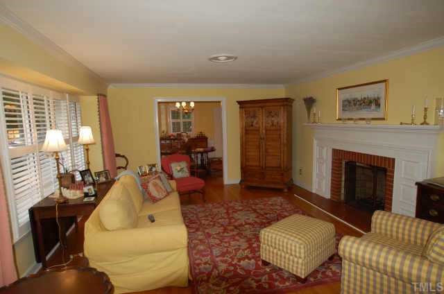 3213 Oak Grove Circle Raleigh, NC 27607 - Photo 4 of 10 a living room with furniture and a fireplace
