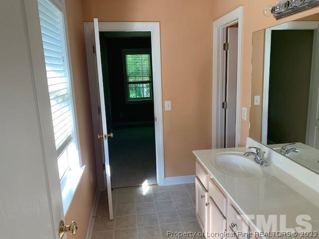 418 Summers Walk Circle Garner, NC 27529 - Photo 8 of 17 a bathroom with a sink and a mirror