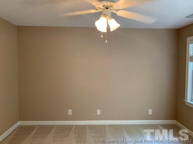 418 Summers Walk Circle Garner, NC 27529 - Photo 9 of 17 a view of a small space with wooden floor and a chandelier fan