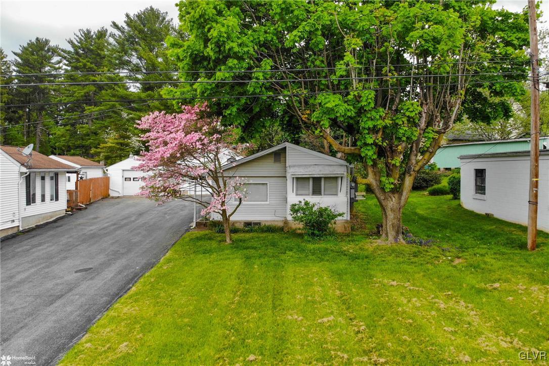 491 Sportsman Club Road Nazareth, PA 18064 - Photo 2 of 25 a front view of a house with a yard and trees