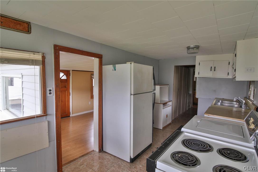 491 Sportsman Club Road Nazareth, PA 18064 - Photo 7 of 25 a kitchen with a refrigerator and a sink