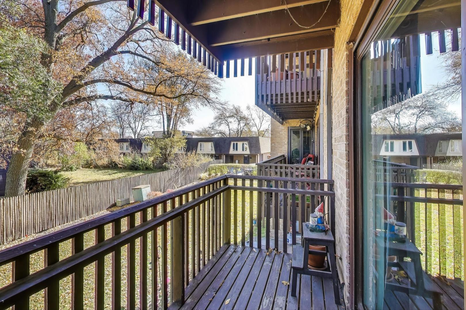 1847 Tanglewood Drive, Unit 2B Glenview, IL 60025 - Photo 22 of 26 a view of a balcony with wooden floor