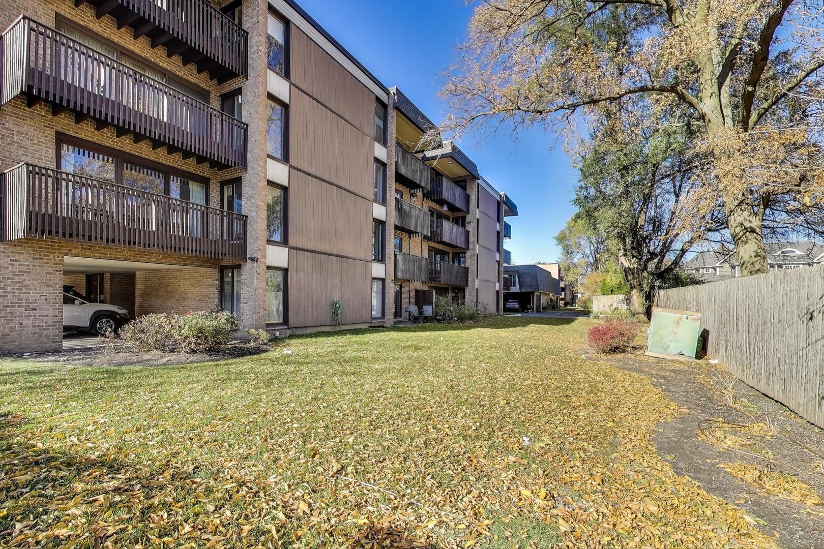 1847 Tanglewood Drive, Unit 2B Glenview, IL 60025 - Photo 24 of 26 a view of a building with a street