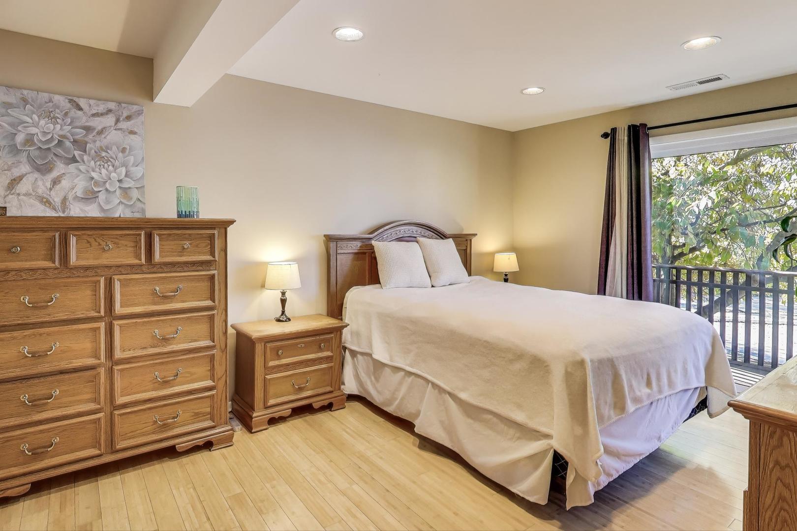 1847 Tanglewood Drive, Unit 2B Glenview, IL 60025 - Photo 9 of 26 a bedroom with a bed and a window