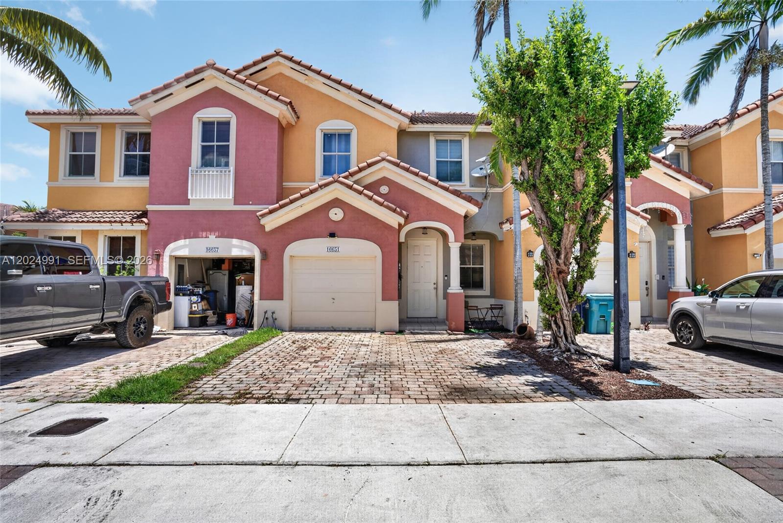 16651 Southwest 79th Terrace Miami, FL 33193 - Photo 1 of 34 a front view of a house with a yard