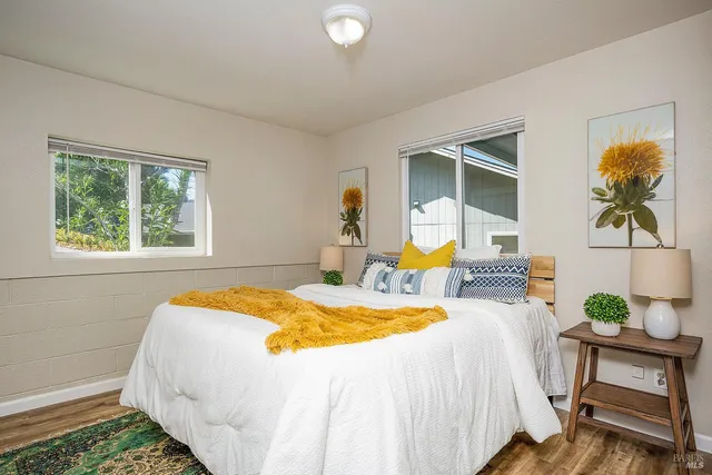 a bedroom with a bed and a table