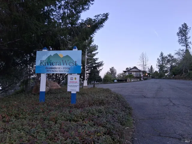 a sign board with a yard