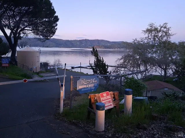 a view of a chairs and table in backyard