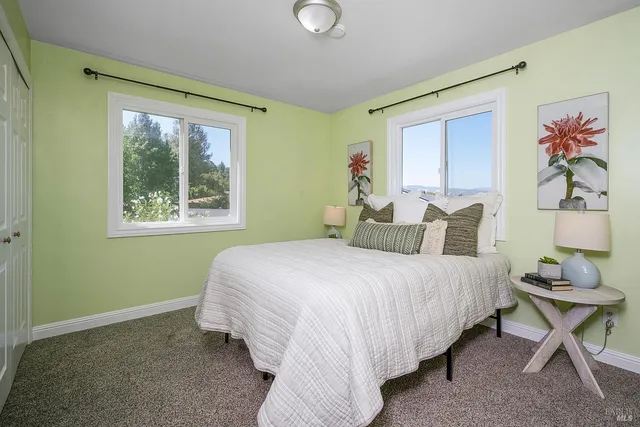 a bedroom with a bed and window