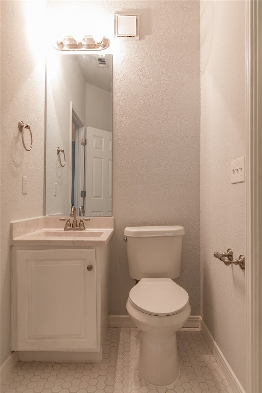 2204 San Gabriel Street, Unit 104 Austin, TX 78705 - Photo 11 of 18 Half bathroom featuring vanity and tile patterned flooring