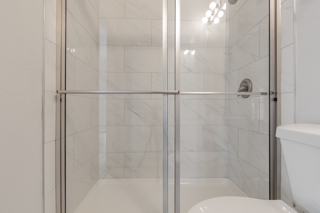 2204 San Gabriel Street, Unit 104 Austin, TX 78705 - Photo 13 of 18 Bathroom with a stall shower