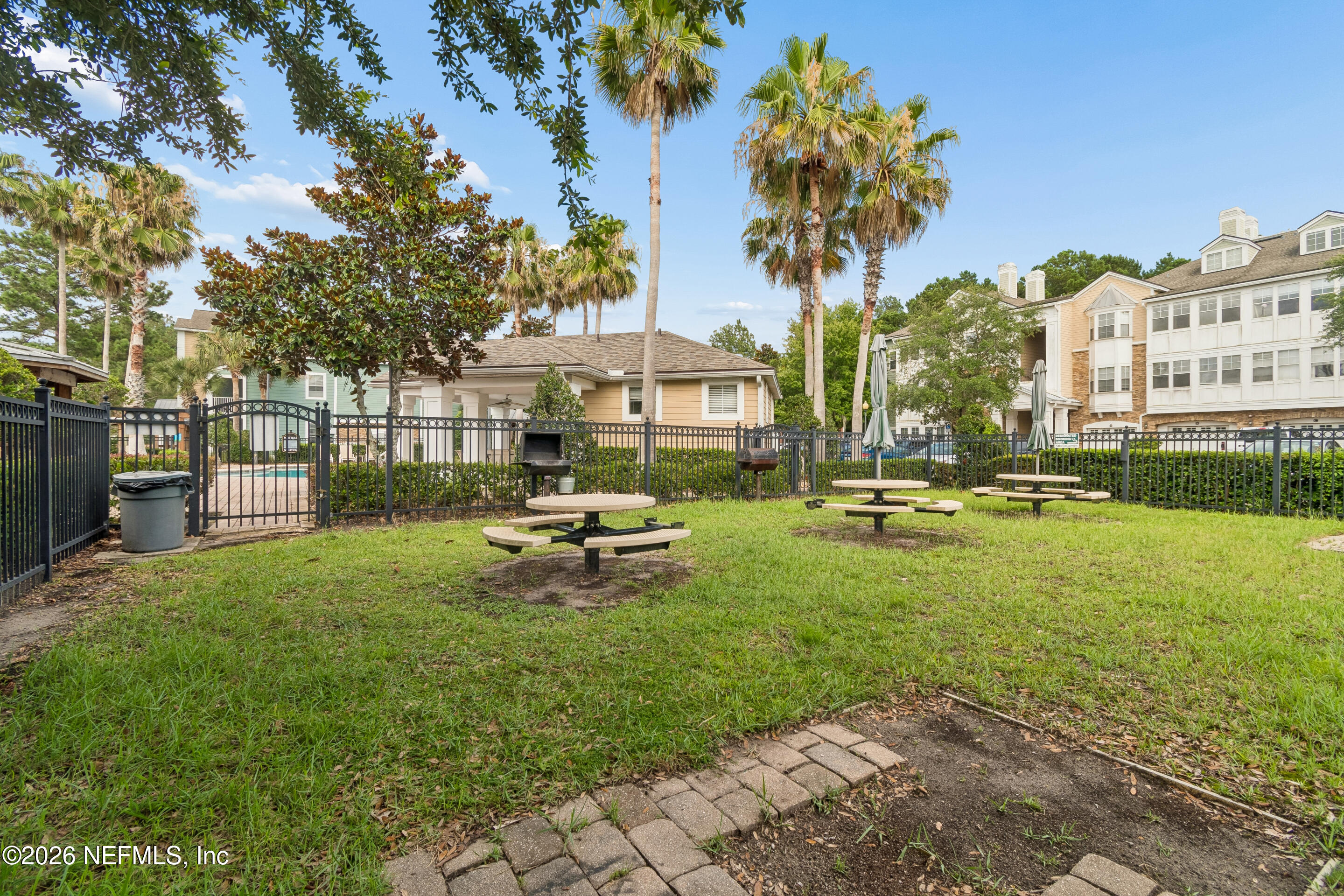 8550 Touchton Road, Unit 511 Jacksonville, FL 32216 - Photo 47 of 63 a view of a park with bench and trees