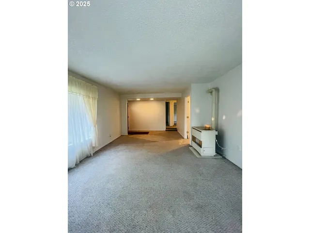 a view of a room with a bathroom and sink