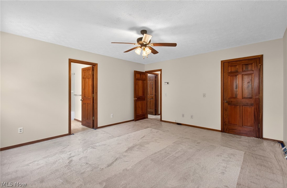 5346 Burlawn Street Northwest Canton, OH 44708 - Photo 16 of 40 Light-toned walls with contrasting dark wood trim and doors