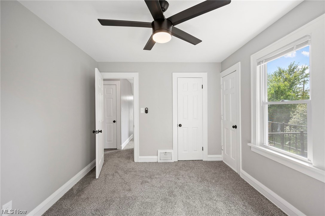 1022 Englewood Road Cleveland, OH 44121 - Photo 22 of 33 Unfurnished bedroom featuring light colored carpet and ceiling fan